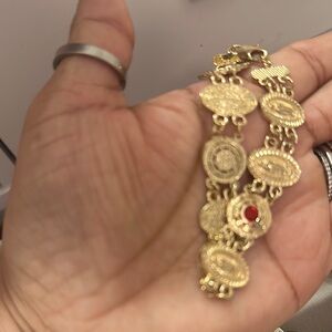 Elegant Gold Bracelet with Red Accent